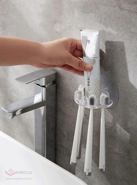 Toothbrush/paste/razor holder